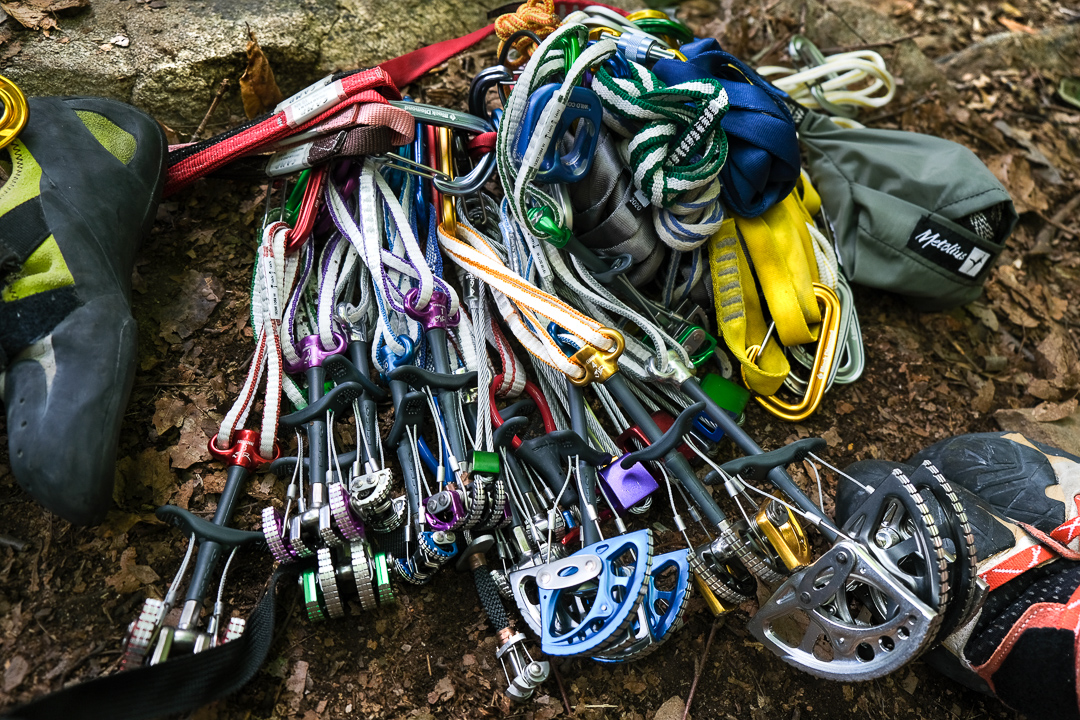 A traditional climbing rack (trad rack) and shoes